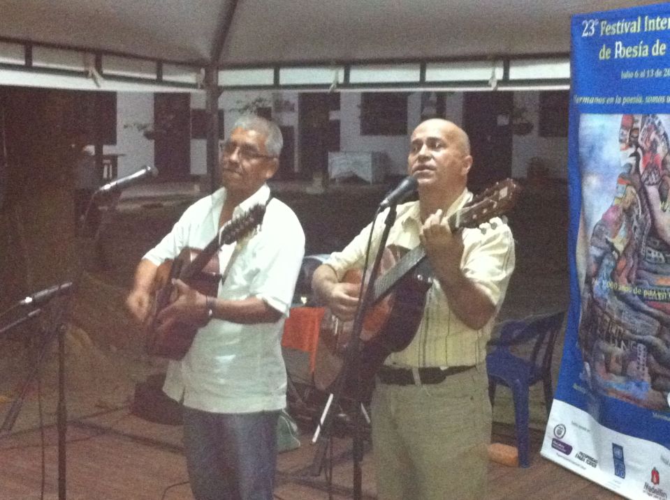 two men with guitars