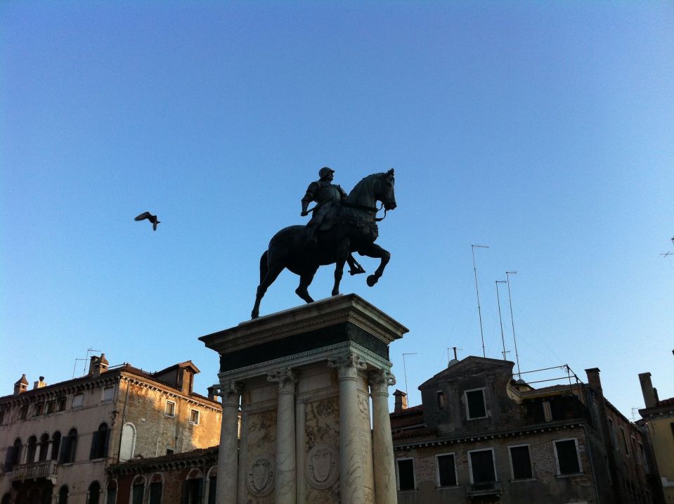 Colleoni statue with bird, evening.