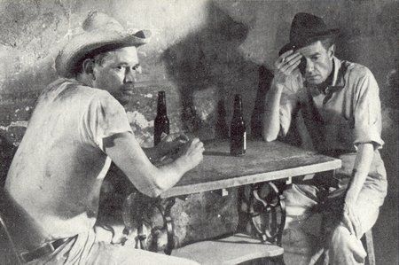 Juan Rulfo (left) and Abel Quezada having a beer, in a scene from ‘En este pueblo no hay ladrones’ based on a short story by Gabriel García Márquez.