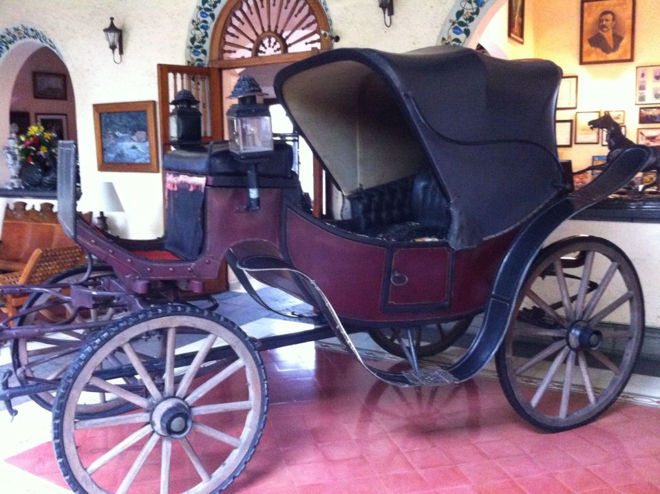 Carriage in foyer of the Posada de Coatepec, used by formerly Important People.
